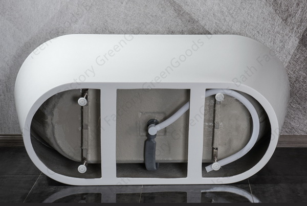 Oval freestanding bathtub with freestanding tub faucet