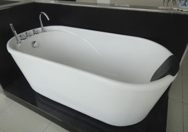 freestanding soaking tub with soft bath pillow