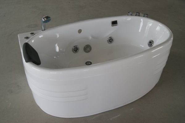 Oval whirlpool tubs with faucet, pillow and jets